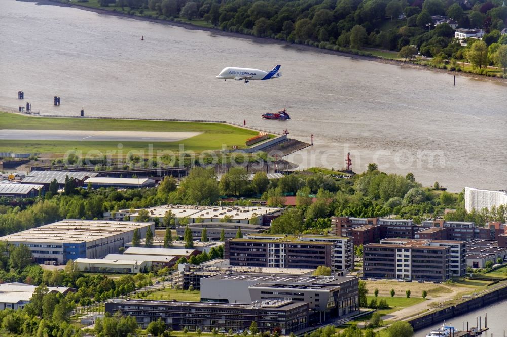 Hamburg from above - Approaching transport aircraft A300-600ST (Beluga) from Airbus on the airfield Hamburg-Finkenwerder. Operator of the aircraft is the Airbus Group