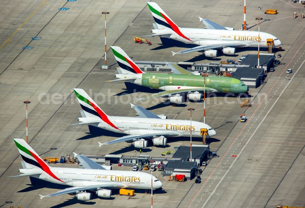 Aerial image Hamburg - Airbus airplanes of Emirates Airlines on the works facilities and area of Finkenwerder in Hamburg in Germany. The former Hamburger Flugzeugbau works include an Airbus production site with an airplane. Several Airbus planes and modells are being constructed here