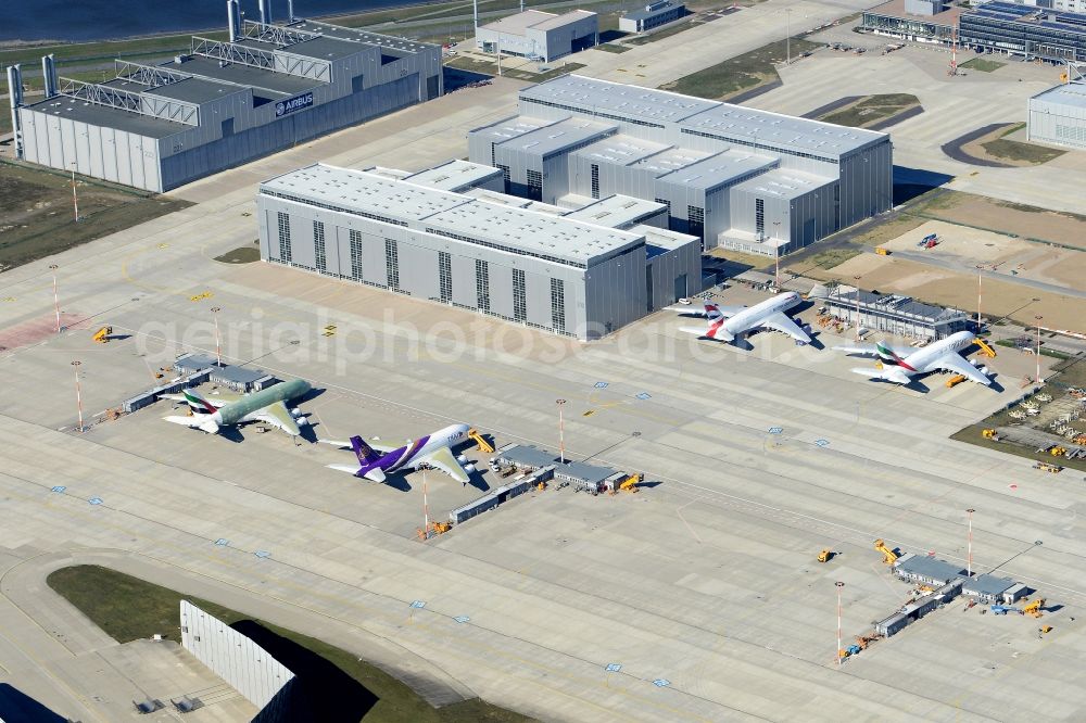 Aerial image Hamburg - Airbus airplanes of Emirates Airlines on the works facilities and area of Finkenwerder in Hamburg in Germany