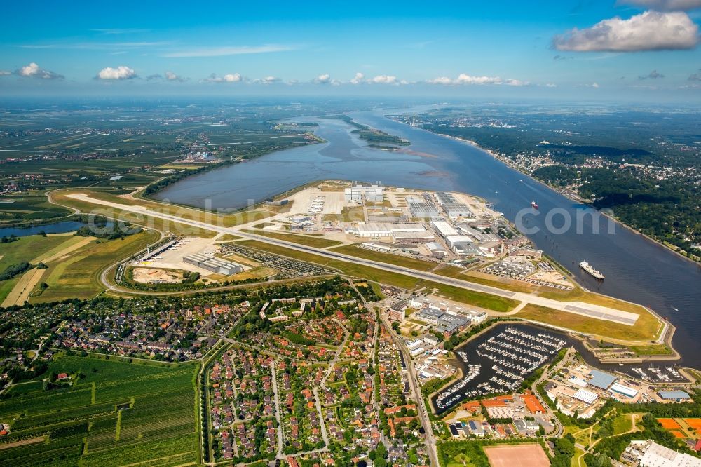 Aerial image Hamburg - Airbus works and airport of Finkenwerder in Hamburg in Germany. The former Hamburger Flugzeugbau works - on the Finkenwerder Peninsula on the riverbank of the Elbe - include an Airbus production site with an airplane. Several Airbus planes and models are being constructed here