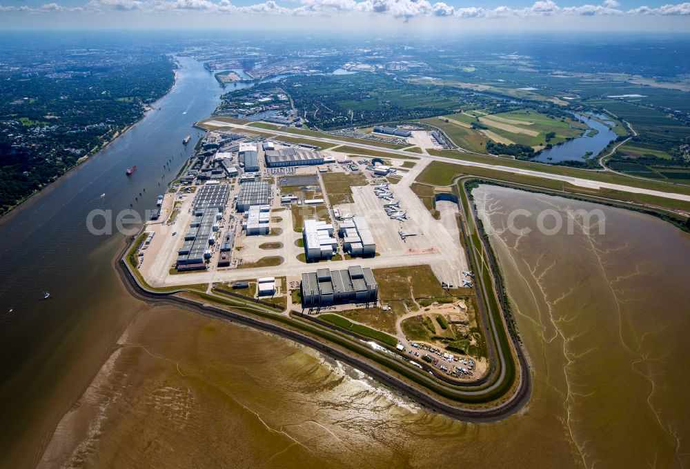 Aerial image Hamburg - Airbus works and airport of Finkenwerder in Hamburg in Germany. The former Hamburger Flugzeugbau works - on the Finkenwerder Peninsula on the riverbank of the Elbe - include an Airbus production site with an airplane. Several Airbus planes and models are being constructed here