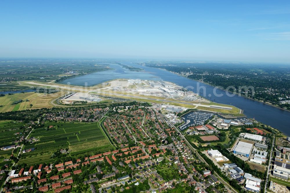 Aerial image Hamburg - Airbus works and airport of Finkenwerder in Hamburg in Germany. The former Hamburger Flugzeugbau works - on the Finkenwerder Peninsula on the riverbank of the Elbe - include an Airbus production site with an airplane. Several Airbus planes and models are being constructed here