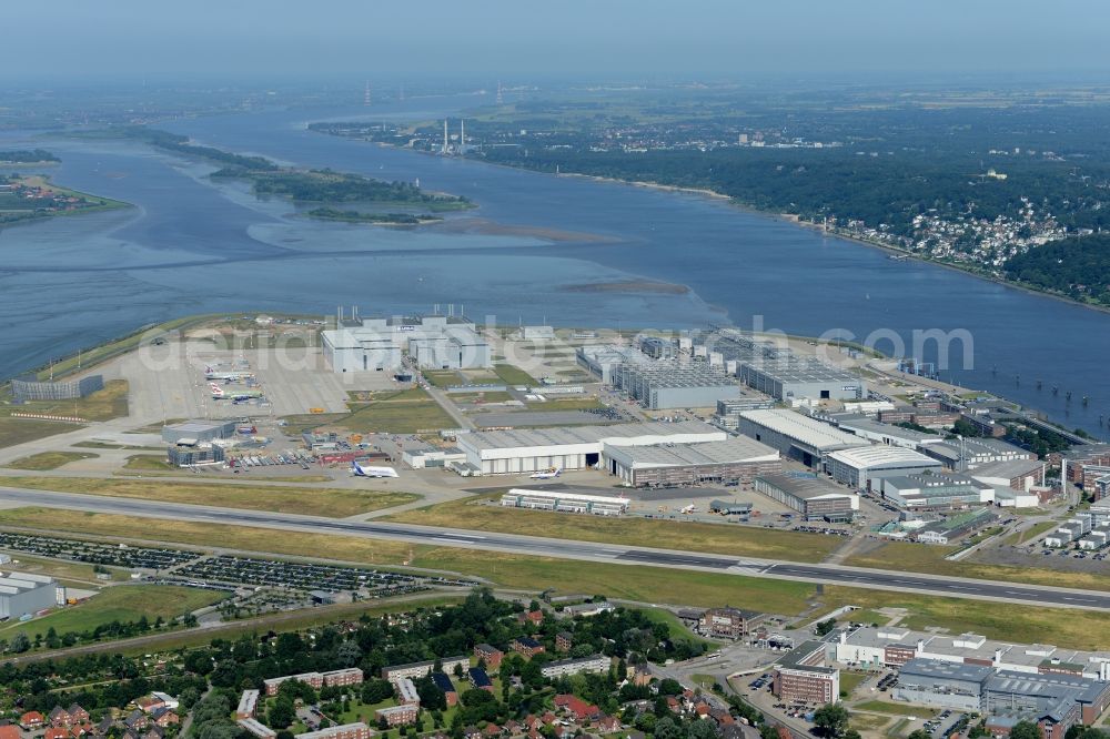 Aerial photograph Hamburg - Airbus works and airport of Finkenwerder in Hamburg in Germany. The former Hamburger Flugzeugbau works - on the Finkenwerder Peninsula on the riverbank of the Elbe - include an Airbus production site with an airplane. Several Airbus planes and models are being constructed here