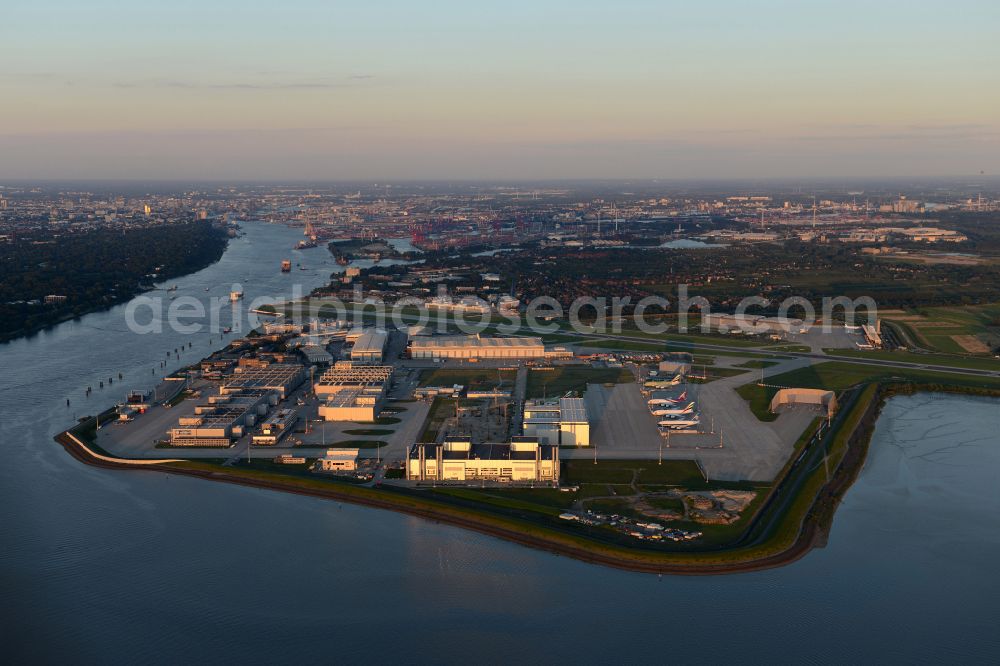 Aerial photograph Hamburg - Airbus works and airport of Finkenwerder in Hamburg in Germany. The former Hamburger Flugzeugbau works - on the Finkenwerder Peninsula on the riverbank of the Elbe - include an Airbus production site with an airplane. Several Airbus planes and models are being constructed here