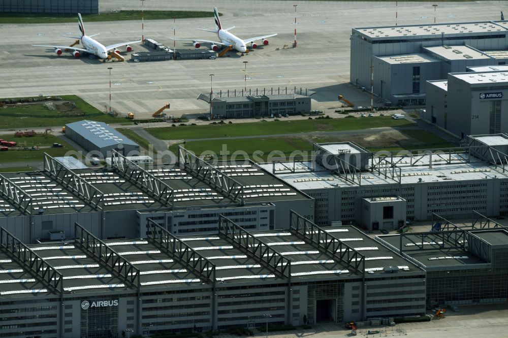 Hamburg from above - Airbus works and airport of Finkenwerder in Hamburg in Germany. The former Hamburger Flugzeugbau works - on the Finkenwerder Peninsula on the riverbank of the Elbe - include an Airbus production site with an airplane. Several Airbus planes and models are being constructed here