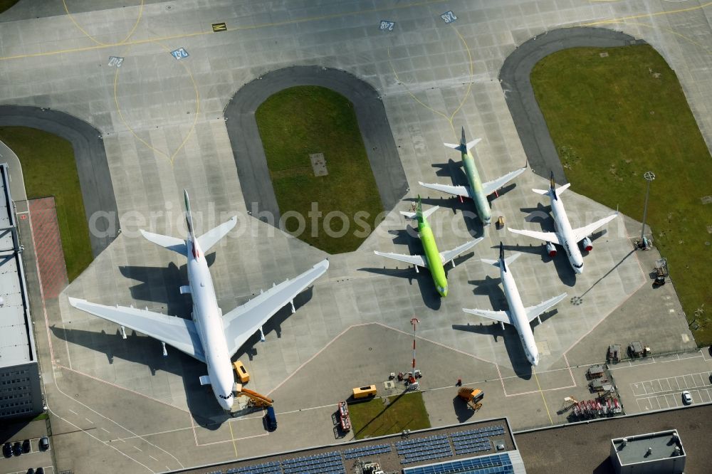 Hamburg from above - Airbus works and airport of Finkenwerder in Hamburg in Germany. The former Hamburger Flugzeugbau works - on the Finkenwerder Peninsula on the riverbank of the Elbe - include an Airbus production site with an airplane. Several Airbus planes and models are being constructed here