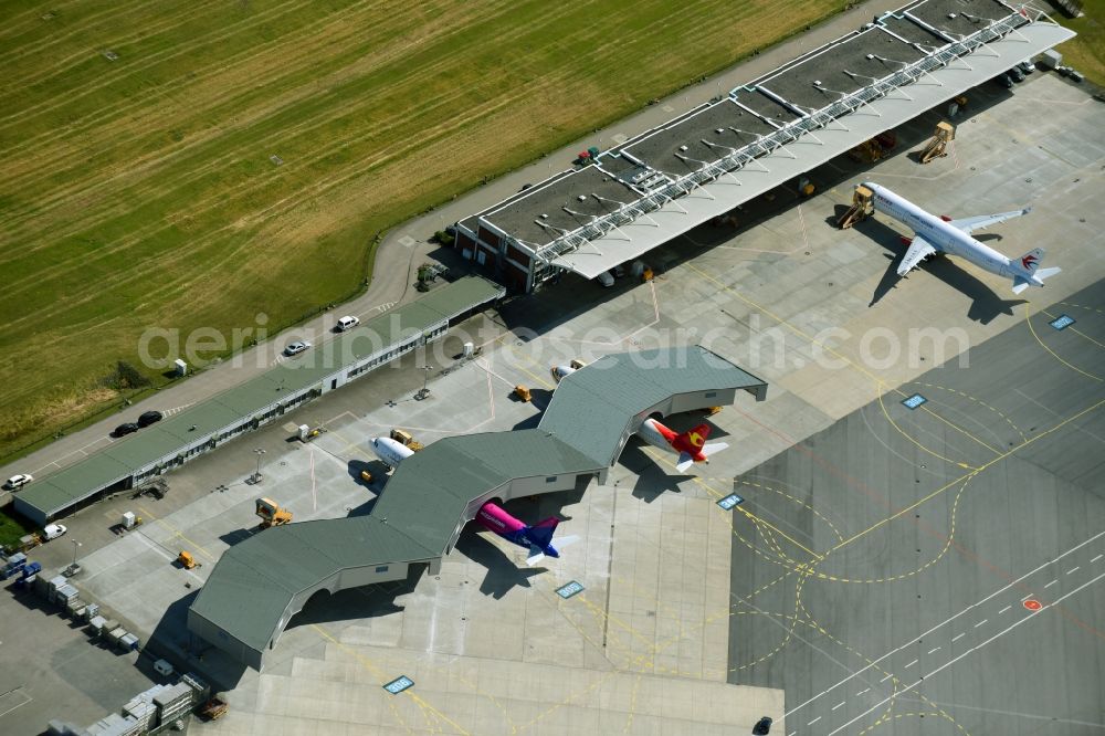 Hamburg from above - Airbus works and airport of Finkenwerder in Hamburg in Germany. The former Hamburger Flugzeugbau works - on the Finkenwerder Peninsula on the riverbank of the Elbe - include an Airbus production site with an airplane. Several Airbus planes and models are being constructed here