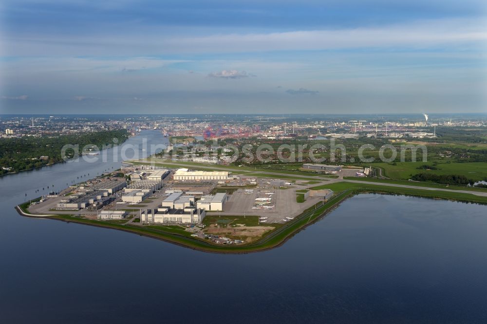 Hamburg from above - Airbus works and airport of Finkenwerder in Hamburg in Germany. The former Hamburger Flugzeugbau works - on the Finkenwerder Peninsula on the riverbank of the Elbe - include an Airbus production site with an airplane. Several Airbus planes and models are being constructed here