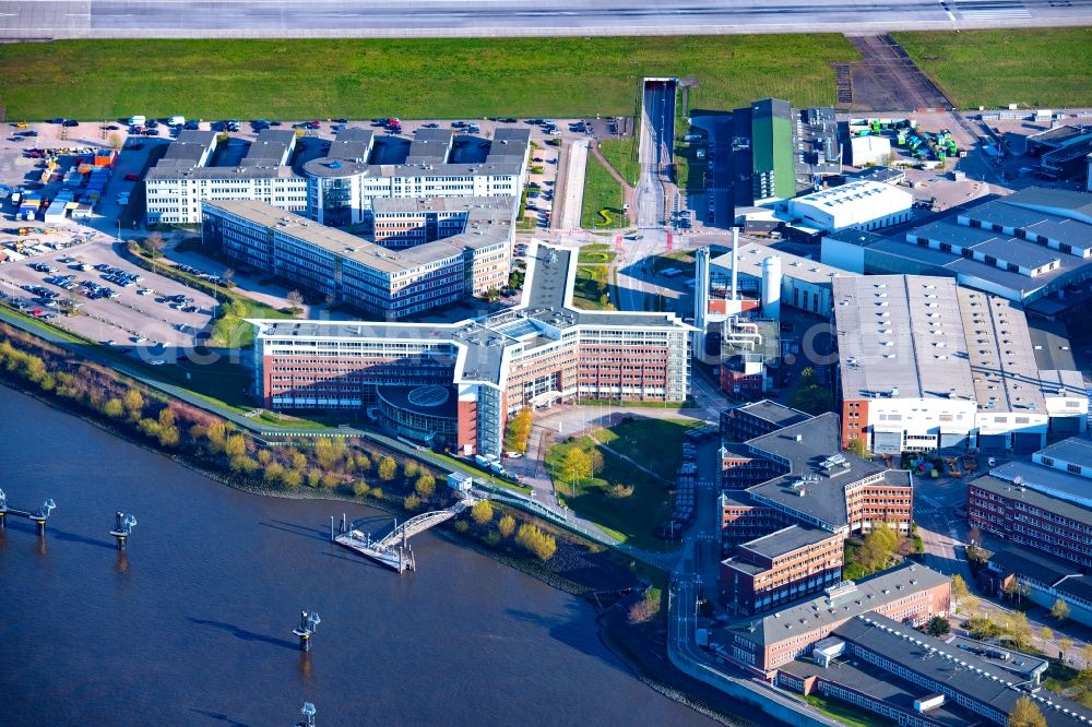 Hamburg from above - Airbus works and airport of Finkenwerder in Hamburg in Germany. The former Hamburger Flugzeugbau works - on the Finkenwerder Peninsula on the riverbank of the Elbe - include an Airbus production site with an airplane. Several Airbus planes and models are being constructed here