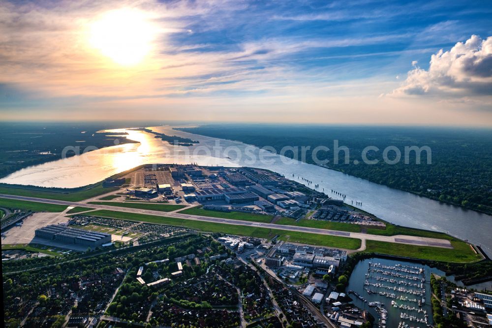 Hamburg from the bird's eye view: Airbus Finkenwerder factory site in the sunset in Hamburg, Germany