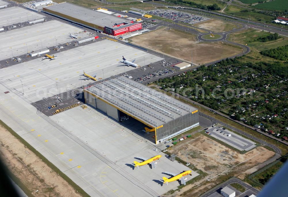 Schkeuditz from above - Gelände des Airport Leipzig-Halle auch Flughafen Schkeuditz genannt. Der Flughafen hat vor allem im Bereich des Luftfrachtverkehrs internationale Bedeutung durch den ausgebauten DHL - Logistikbereich. Site of the Airport Leipzig-Halle airport - called Airport Schkeuditz. The airport has especially in the field of air cargo international importance by the upgraded the DHL logistics field.