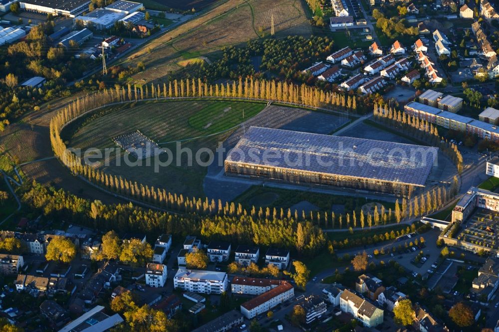 Herne from the bird's eye view: Modern skirted with autumnal colored tree lines building of the Academy Mont Cenis in Herne in North Rhine-Westphalia