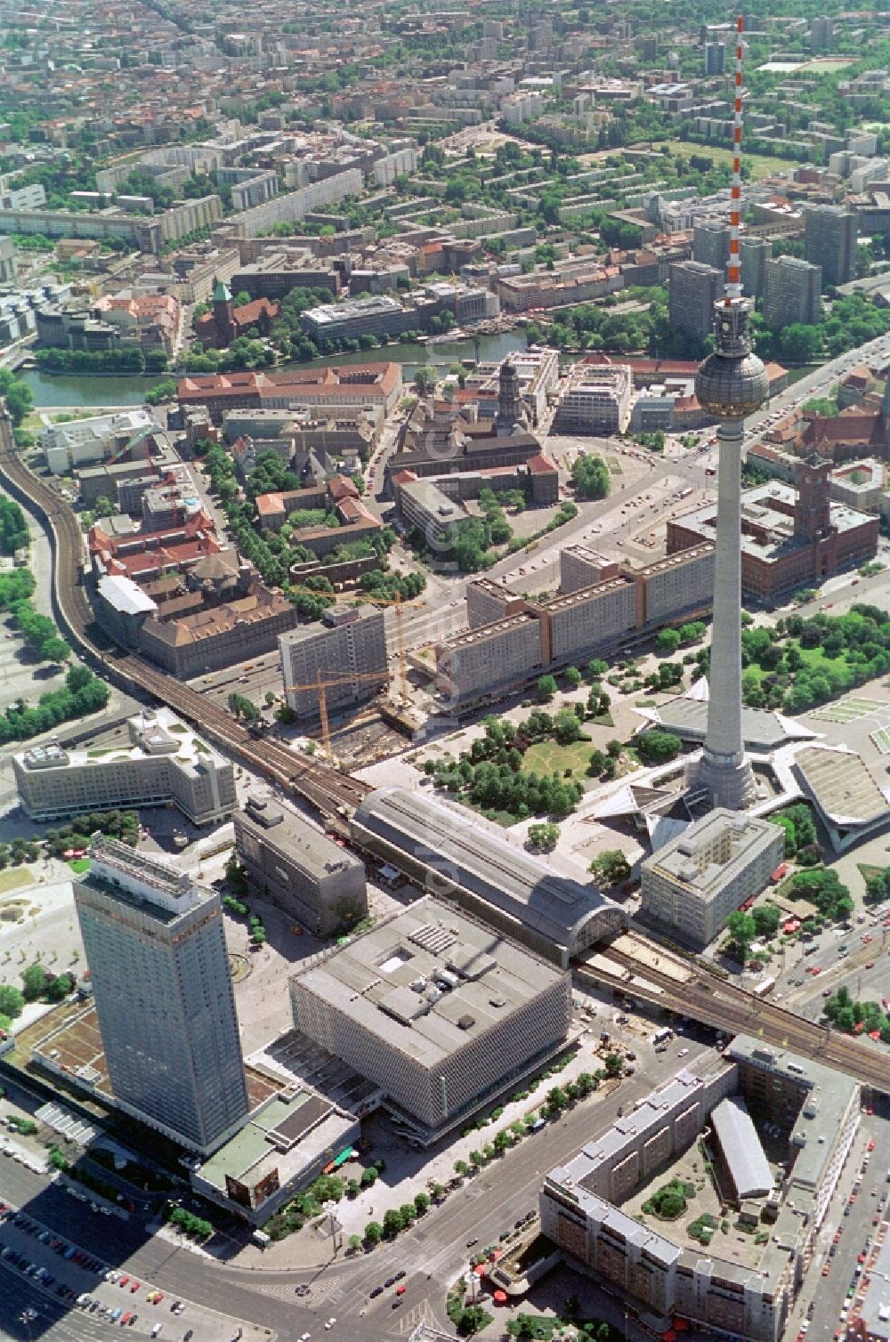 Berlin from the bird's eye view: The Alexanderplatz in the City-East of Berlin-Mitte with its sights Fernseturm and Rotes Rathaus is an attraction for tourists. Good to see are the former Forum Hotel, Alexanderplatz Station, the Rathauspassagen, the district court center, the Old Town House and the ruins of the Franciscan monastery church