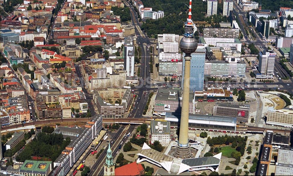 Berlin from above - The Alexanderplatz square with the dominant structure of the television tower in Berlin-Mitte. In the background along the Prenzlauer Allee residential areas of Prenzlauer Berg and neighboring Friedrichshain. Good to see the theater Volksbuehne at Rosa-Luxemburg-Platz