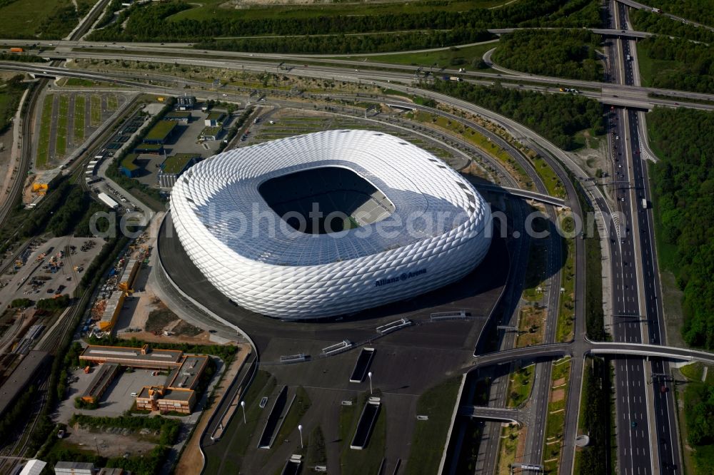 München from the bird's eye view: The Allianz Arena in Munich in Bavaria is a football stadium of the the Munich football club FC Bayern Muenchen. The facade of the, designed by the architects Herzog & de Meuron stadium Allianz Arena Muenchen Stadion GmbH consists of illuminated white foil cushions