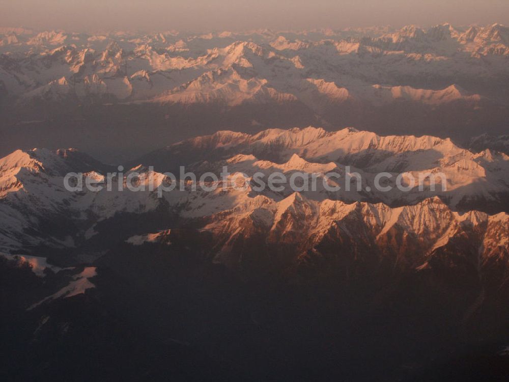 Aerial photograph Tessin / Schweiz - Blick auf schneebedeckte Alpengipfel der Tessiner Alpen in der späten Abendsonne. Die Täler liegen bereits im dichten Nebel