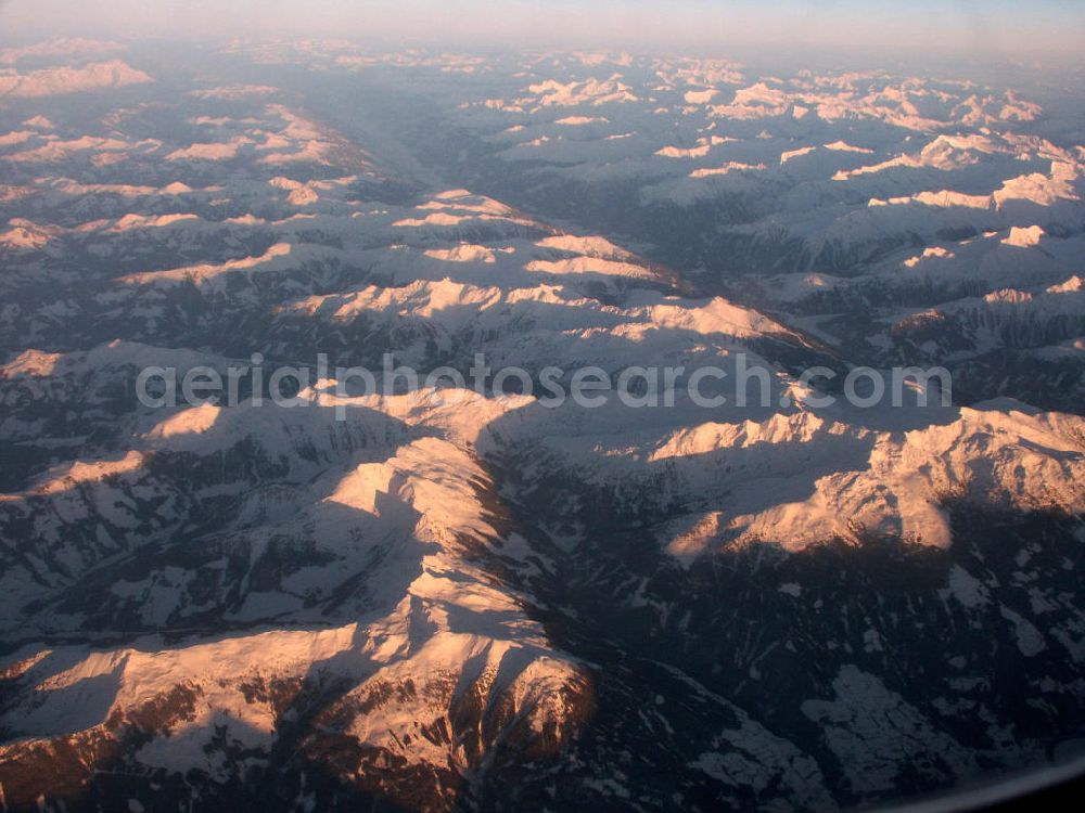 Aerial image Tessin - Blick auf Schneebedeckte Alpengipfel der Tessiner Alpen in der späten Abendsonne. Die Täler liegen bereits im dichten Nebel