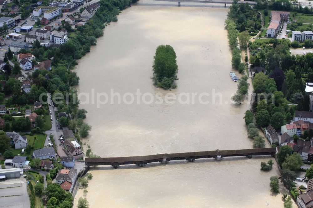 Bad Säckingen from the bird's eye view: Fridolin island and wooden bridge over the Rhine at Bad Saeckingen in the state of Baden-Wuerttemberg. The Rhine as border with Switzerland has flood