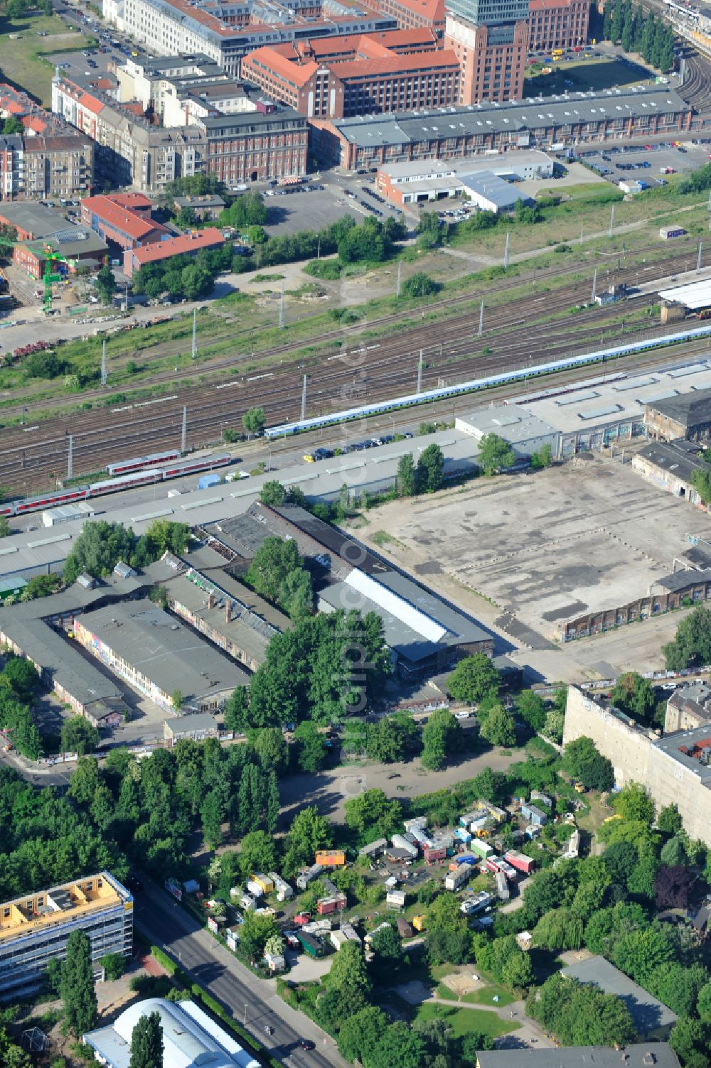 Berlin from the bird's eye view: Wagon camp - caravan and tent - campsite - and tent site of the alternative sceneon the former RAW site on street Revaler Strasse in Berlin, Germany