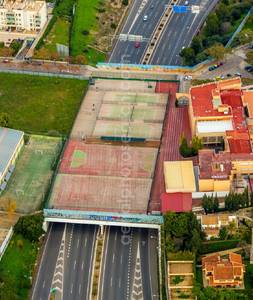 Palma from the bird's eye view: Pistas Tenis De La Purisima tennis court as a tunnel construction over the route of the MA-20 motorway in the district of Ponent in Palma on the Balearic island of Mallorca, Spain