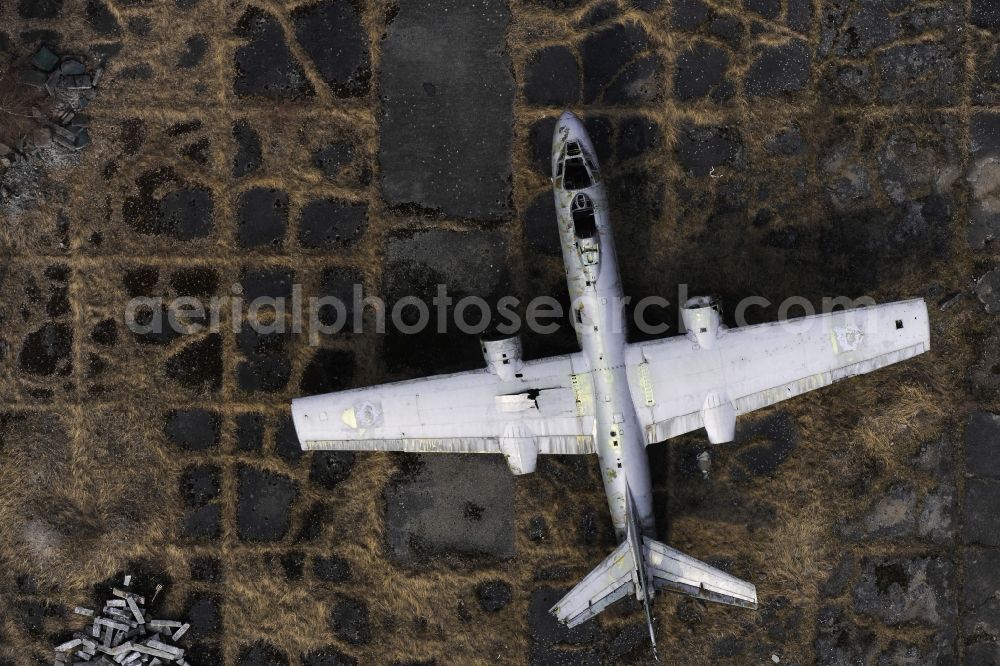 Peenemünde from above - View of an old plane wreck on the area of the Peenemuende Airfield in the state Mecklenburg-Vorpommern