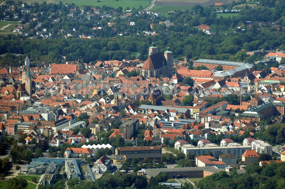 Aerial photograph Ingolstadt - Blick auf den Münster, Moritzkirche mit Pfeifturm und das Gnadenthal- Gymnasium. Das Gnadenthal- Gymnasium ist ein katholisches Gymnasium in Trägerschaft der Diözese Eichstätt in Ingolstadt. Die St. Moritzkirche ist die älteste Kirche der Stadt. Neben dem eigentlichen Kirchturm ragt hier der gotische Pfeifturm, der ehemalige städtische Wachturm, in die Höhe. Der Münster birgt im inneren mächtige Öltäre, wertvolle Reliefs und Figuren aus Stein, Bildnisse, wertvolle Reliefs und Schnitzwerke. Homepage: http://