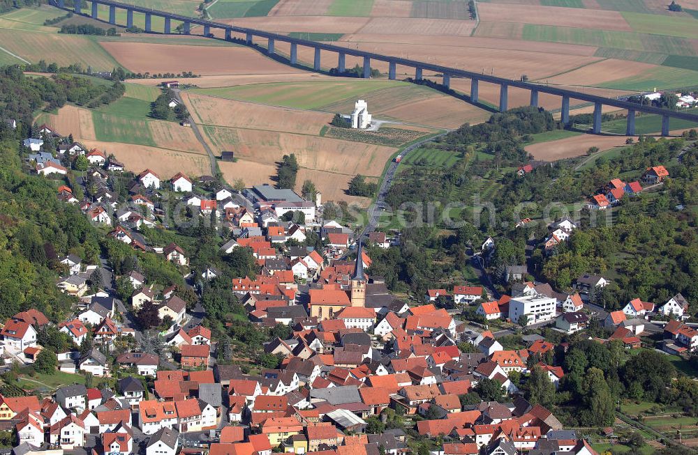 Aerial image Leinach - Blick auf die Altstadt mit der Julius-Echter-Kirche und ICE-Strecke von Leinach in Bayern. Die Neubaustrecke verbindet die Städte Würzburg und Hannover und führt an der Altstadt und der Julius-Echter-Kirche von Leinach vorbei. Die Kirche wurde im 13. Jahrhundert erbaut und ist seit 1975 ungenutzt. Kontakt: Förderverein Julius-Echter-Kirche, Am Anger 34, 97274 Leinach, Tel. +49(0)9364 3146; Kontakt Touristinfo: Tourist-Information Spessart-Mainland, Bayernstraße 18, 63739 Aschaffenburg, Tel. +49(0)6021 3942 71, Fax +49(0)6021 3942 58, Email: tourismus@spessart-touristinfo.de