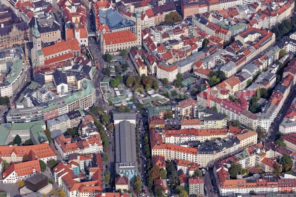 München from above - Old town center around the Viktualienmarkt in Munich in the state of Bavaria. The food market is surrounded by the Schrannenhalle and the churches Alter Peter and Heilig Geist