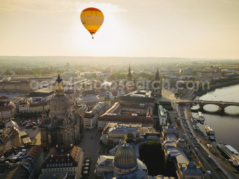 Aerial image Dresden - Night lights and lighting in the old town area and the inner city center Theaterplatz - Terassenufer with the Semper Opera House and the Cathedral of the Sanctissimae Trinitatis (Dresden Court Church) on the Schlossplatz, as well as the Frauenkirche and the Carola Bridge on the banks of the Elbe on the street Terrassenufer in the Altstadt district of Dresden in the state of Saxony, Germany