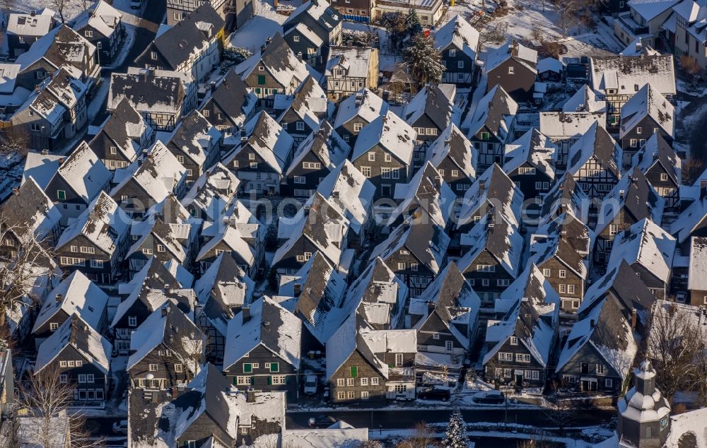 Aerial image Freudenberg - Wintry snowy old Town area and downtown center with half-timbered houses Alter Flecken on the street Krottorfer in Freudenberg in North Rhine-Westphalia