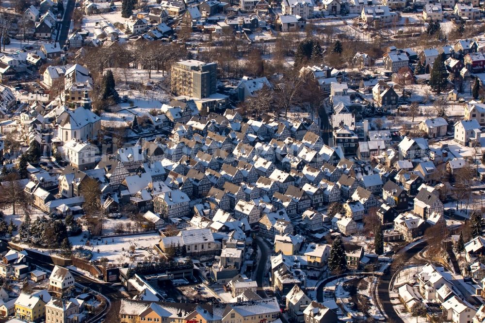 Freudenberg from above - Wintry snowy old Town area and downtown center with half-timbered houses Alter Flecken on the street Krottorfer in Freudenberg in North Rhine-Westphalia