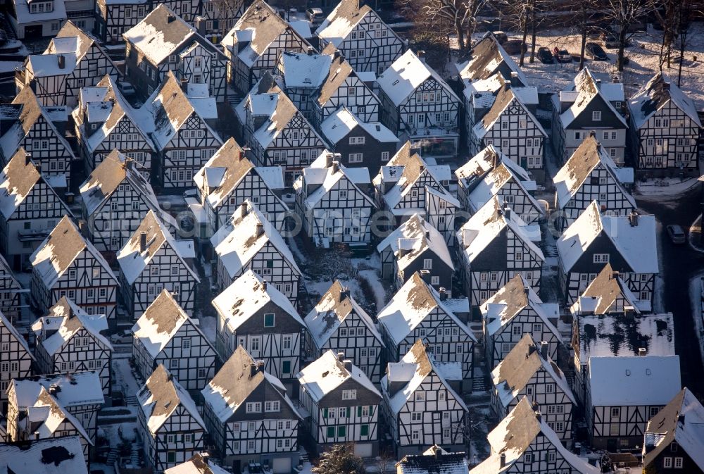 Aerial image Freudenberg - Wintry snowy old Town area and downtown center with half-timbered houses Alter Flecken on the street Krottorfer in Freudenberg in North Rhine-Westphalia