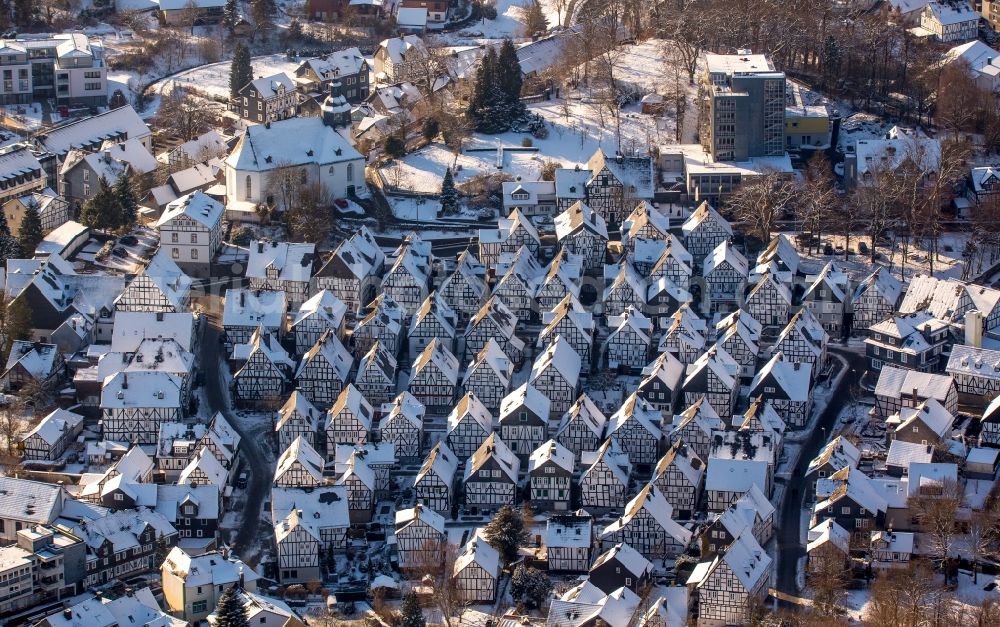 Freudenberg from above - Wintry snowy old Town area and downtown center with half-timbered houses Alter Flecken on the street Krottorfer in Freudenberg in North Rhine-Westphalia