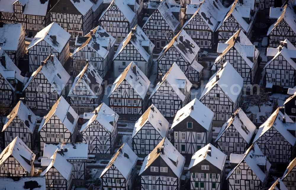 Freudenberg from the bird's eye view: Wintry snowy old Town area and downtown center with half-timbered houses Alter Flecken on the street Krottorfer in Freudenberg in North Rhine-Westphalia