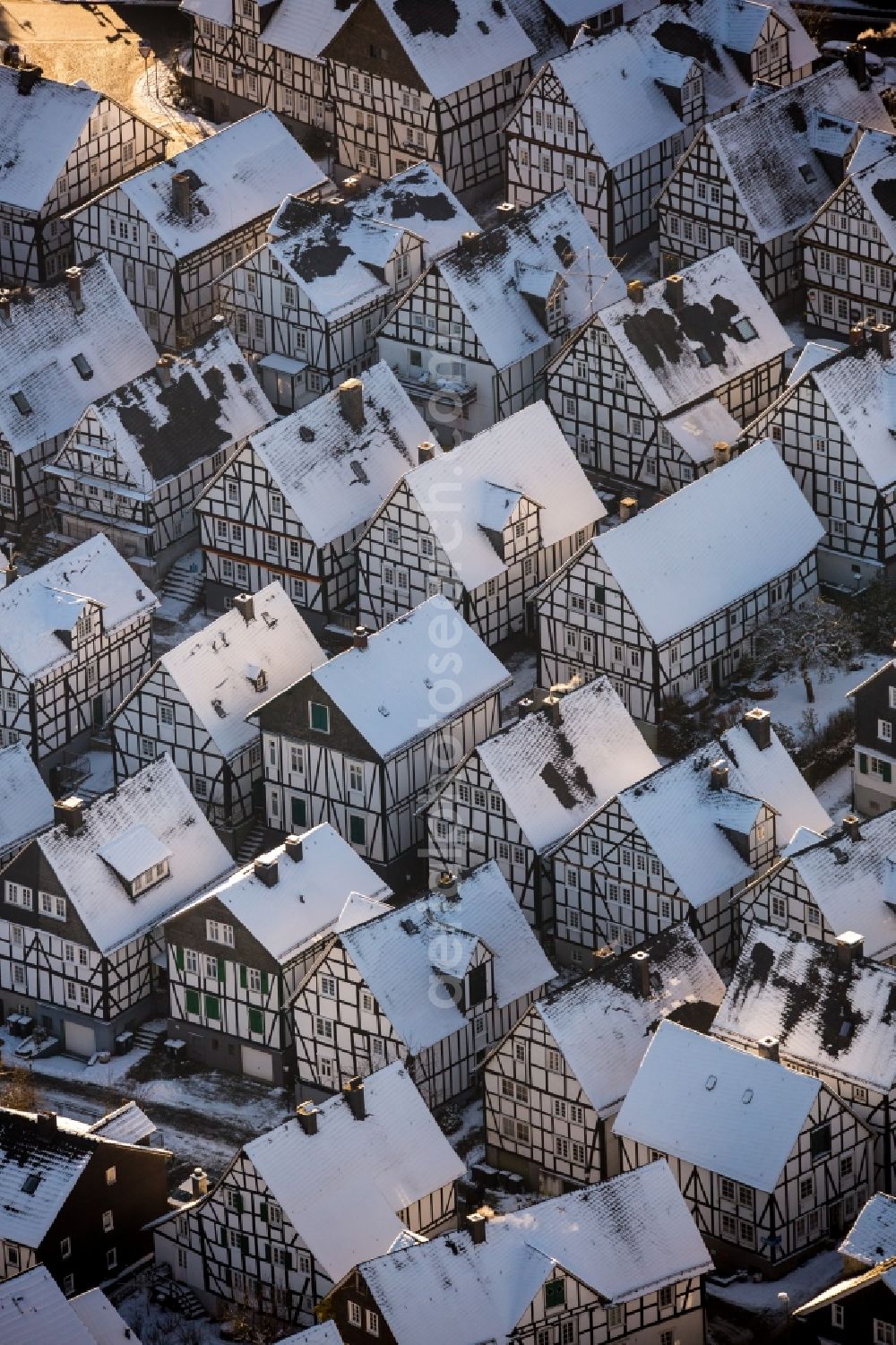 Freudenberg from above - Wintry snowy old Town area and downtown center with half-timbered houses Alter Flecken on the street Krottorfer in Freudenberg in North Rhine-Westphalia