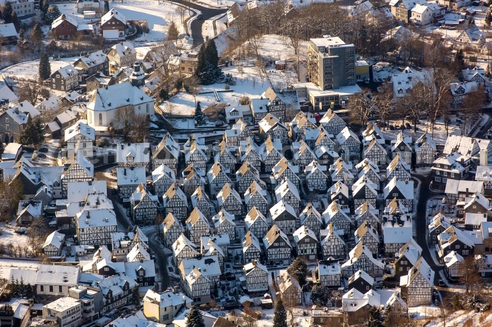 Freudenberg from the bird's eye view: Wintry snowy old Town area and downtown center with half-timbered houses Alter Flecken on the street Krottorfer in Freudenberg in North Rhine-Westphalia