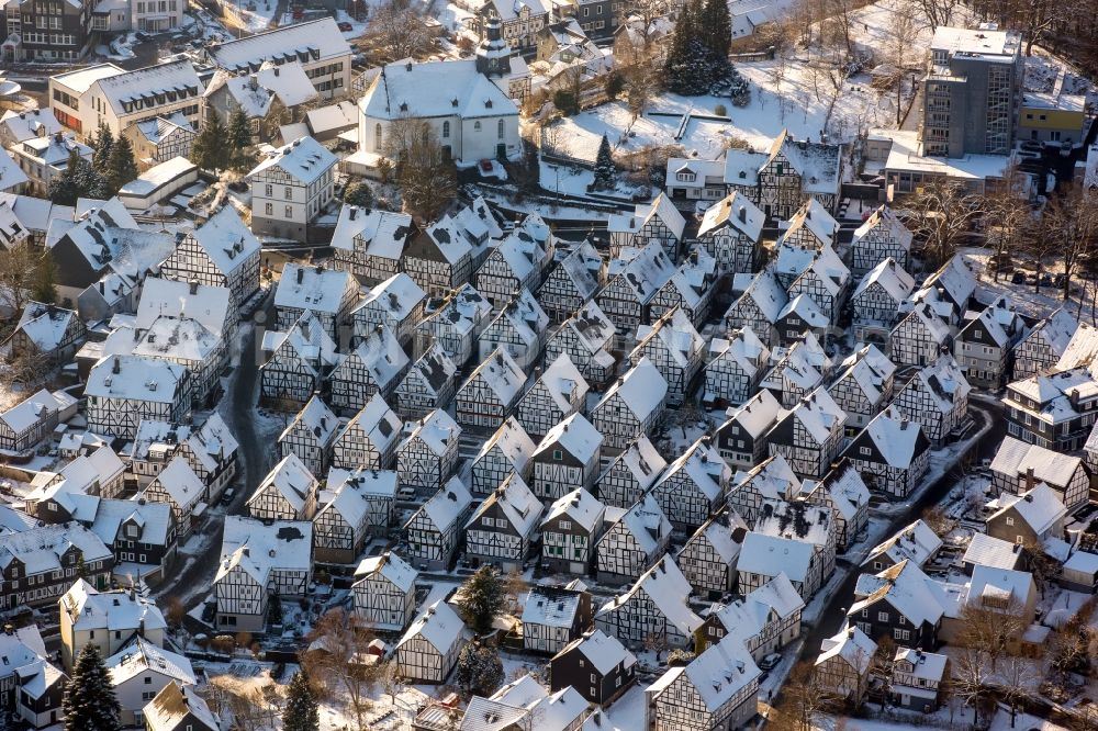 Aerial image Freudenberg - Wintry snowy old Town area and downtown center with half-timbered houses Alter Flecken on the street Krottorfer in Freudenberg in North Rhine-Westphalia