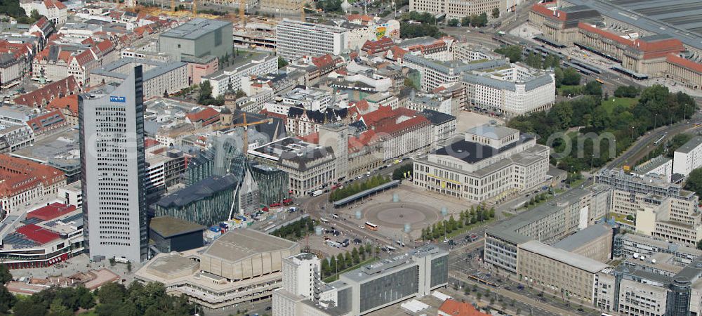 Leipzig from the bird's eye view: Baustelle vom Neubau des Hauptgebäudes der UNI Leipzig, 4.BA am Hochhaus des MDR am Augustusplatz in 04275 Leipzig. Es entsteht ein Neubau der Aula als multifunktionales und repräsentatives Herzstück im entstehnden Campus der Universität Leipzig am Augustusplatz neben dem Hohlen Zahn, dem MDR- Hochhaus. Construction onto the main building of the University of Leipzig.