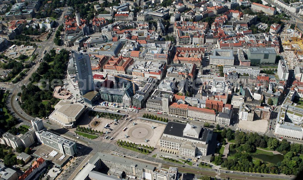 Leipzig from the bird's eye view: Baustelle vom Neubau des Hauptgebäudes der UNI Leipzig, 4.BA am Hochhaus des MDR am Augustusplatz in 04275 Leipzig. Es entsteht ein Neubau der Aula als multifunktionales und repräsentatives Herzstück im entstehnden Campus der Universität Leipzig am Augustusplatz neben dem Hohlen Zahn, dem MDR- Hochhaus. Construction onto the main building of the University of Leipzig.