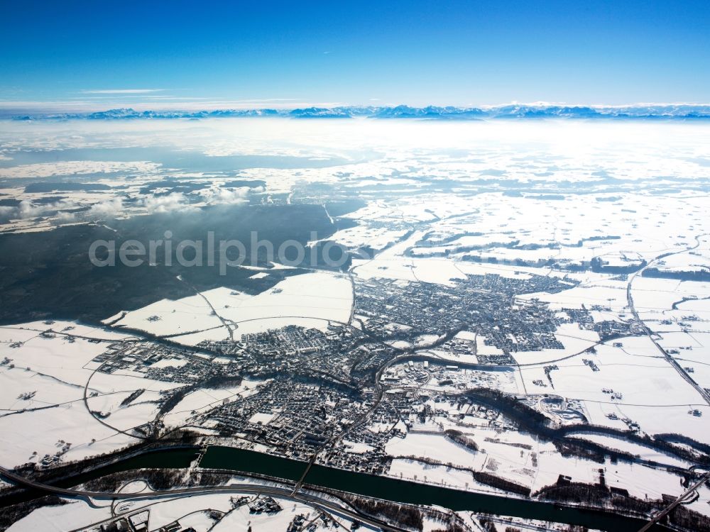 Neuötting from above - The towns of Altoetting and Neuoetting in the state of Bavaria. The two towns are directly adjacent to each other located on the river Inn. Altoetting is larger. The snow-covered panoramic view shows the alps in the background. View from the North to the South