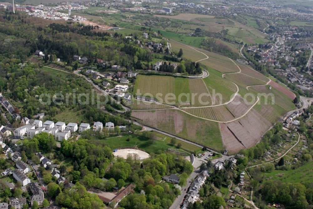 Aerial photograph Trier - The amphitheater from the Roman period with landscape and adjacent residential area on the Bergstrasse in Trier in Rhineland-Palatinate