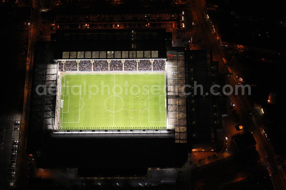 Aerial photograph Liverpool - Luftbild bei Nacht vom Anfield-Stadion während eines Fußballspiels. Das Stadion ist die Heimspielstätte des FC Liverpool. Aerial view at night of Anfield Stadium during a football match. The stadium is the home ground of Liverpool FC.