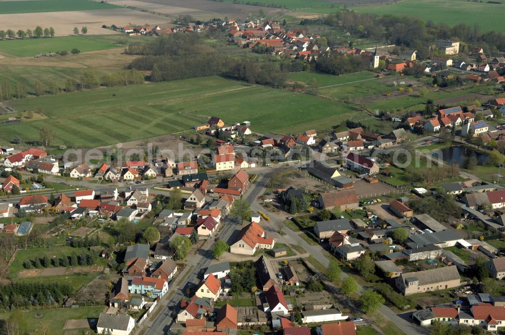 Aerial image Angern - Blick auf die Chausseestrasse Ecke Friedensstrasse in Angern nordöstlich von Wolmirstedt. Angern liegt in Sachsen-Anhalt, Ohrekreis und hat 1300 Einwohner. Erste schriftliche Erwähnungen des Ortes gehen bis in das 14. Jahrhundert zurück. Kontakt: Verbandsverwaltung Elbe-Heide, Magdeburger Strasse 40, 39326 Rogätz, Tel. +49(0)39208 274 0, Fax +49(0)39208 274 32, E-Mail: info@elbe-heide.de