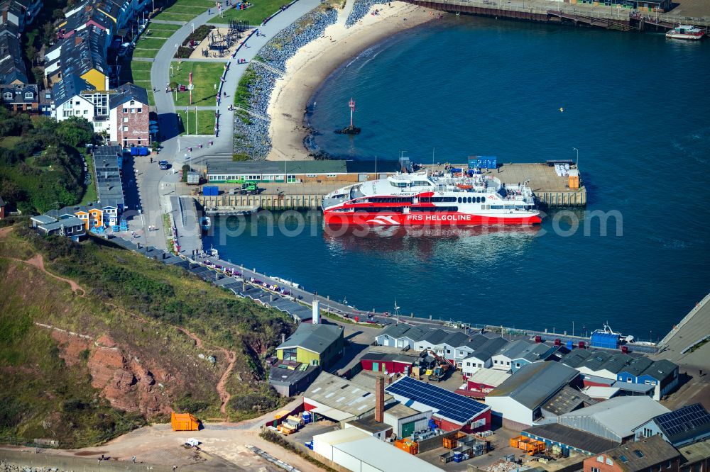 Helgoland from the bird's eye view: Anchored and moored ferry in the harbor Katamaran FRS Halunder Jet on street Am Suedstrand in Helgoland in the state Schleswig-Holstein, Germany