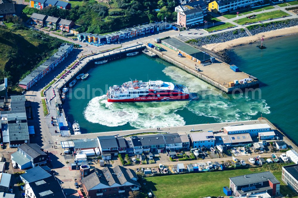 Aerial photograph Helgoland - Anchored and moored ferry in the harbor Katamaran FRS Halunder Jet on street Am Suedstrand in Helgoland in the state Schleswig-Holstein, Germany