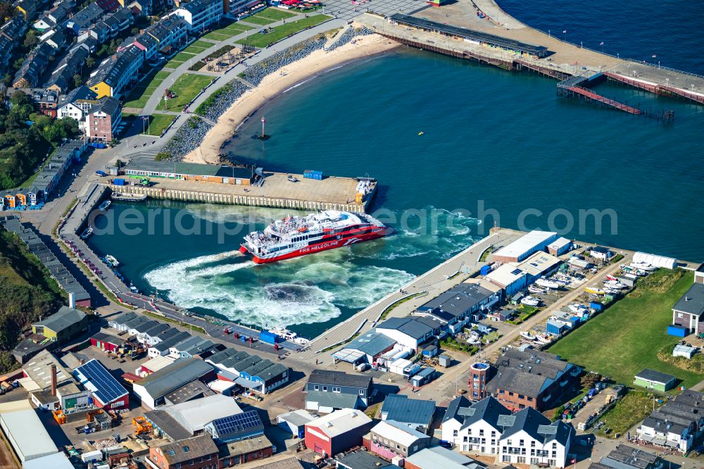 Helgoland from above - Anchored and moored ferry in the harbor Katamaran FRS Halunder Jet on street Am Suedstrand in Helgoland in the state Schleswig-Holstein, Germany