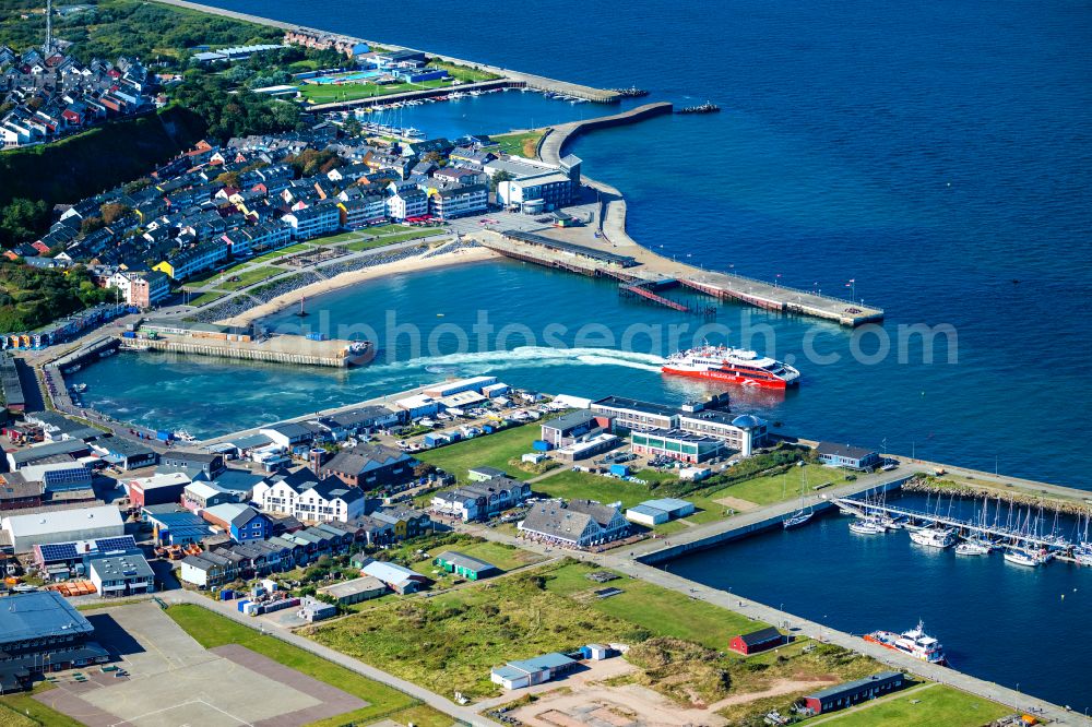 Helgoland from the bird's eye view: Anchored and moored ferry in the harbor Katamaran FRS Halunder Jet on street Am Suedstrand in Helgoland in the state Schleswig-Holstein, Germany