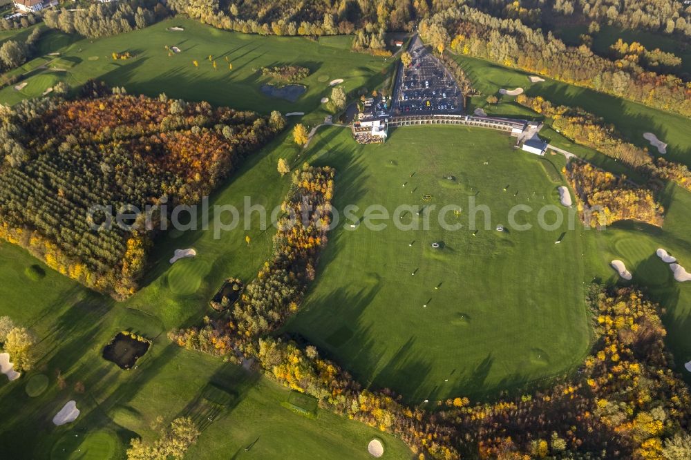 Duisburg from the bird's eye view: View of the autumnal golf course of the club Golf And More at Altenbrucher Damm in Duisburg - Huckingen in the state North Rhine-Westphalia. The golf links with its fairway, rough, bunkering and putting green is located directly on the banks of the lake Remberger See in the south of the Ruhr region city Duisburg