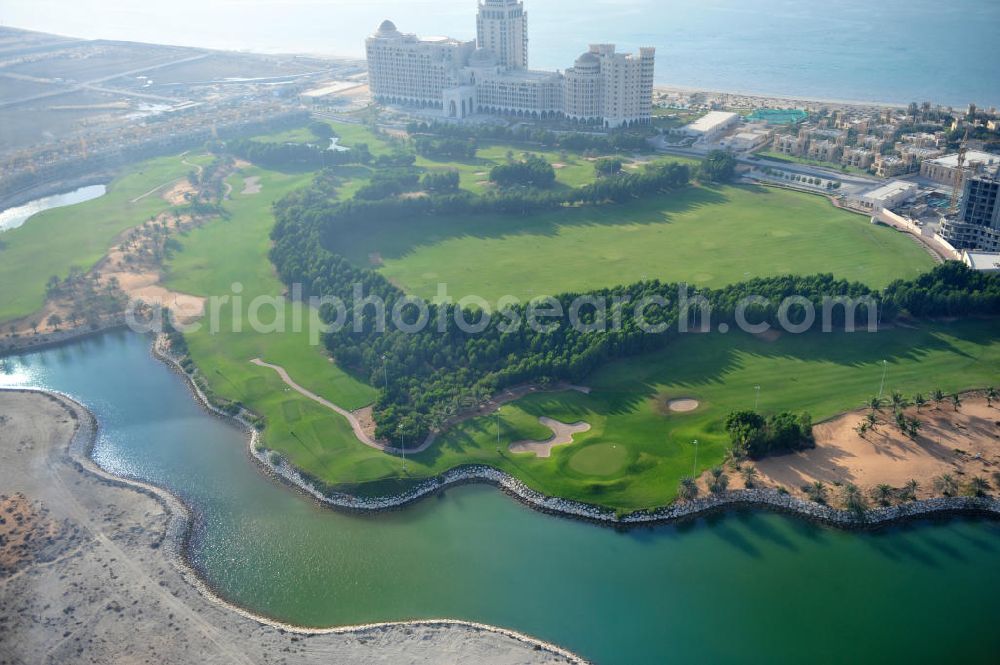 Aerial photograph Ras Al Khaimah - Complex of the Al Hamra Golf Club in the arab emirate Ras Al Khaimah. The golf club is part of the Al Hamra Village Project, the second largest construction project of Ras Al Khaimah. The project is realized by the state-owned company Al Hamra Real Estate