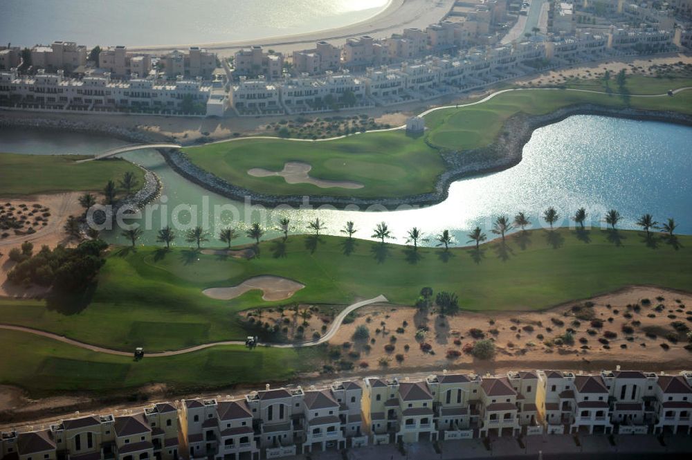 Aerial photograph Ras Al Khaimah - Complex of the Al Hamra Golf Club in the arab emirate Ras Al Khaimah. The golf club is part of the Al Hamra Village Project, the second largest construction project of Ras Al Khaimah. The project is realized by the state-owned company Al Hamra Real Estate